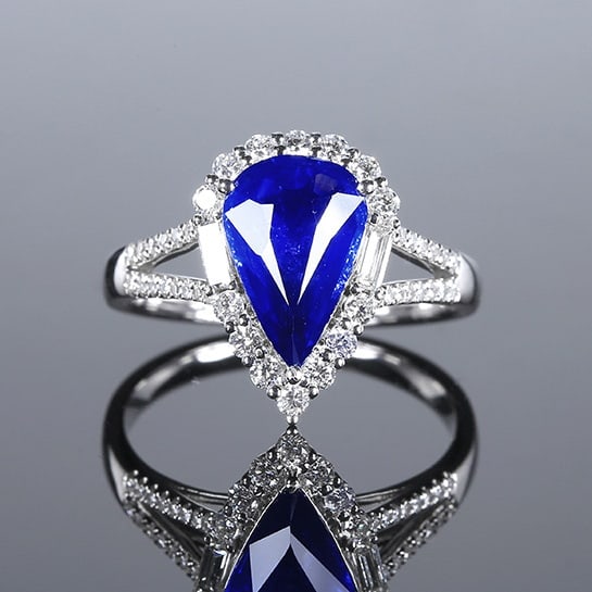 14k Gold 2.60 Ctw Natural Sapphire & Diamond Ring: Ref:230972105 // gold content:14k gold // ring size:7. 25us // // main gemstone:sapphire // shape:pear // carat weight:2. 15ct // color:cornflower blue // treatment:natural // // adjacent gemstone 2