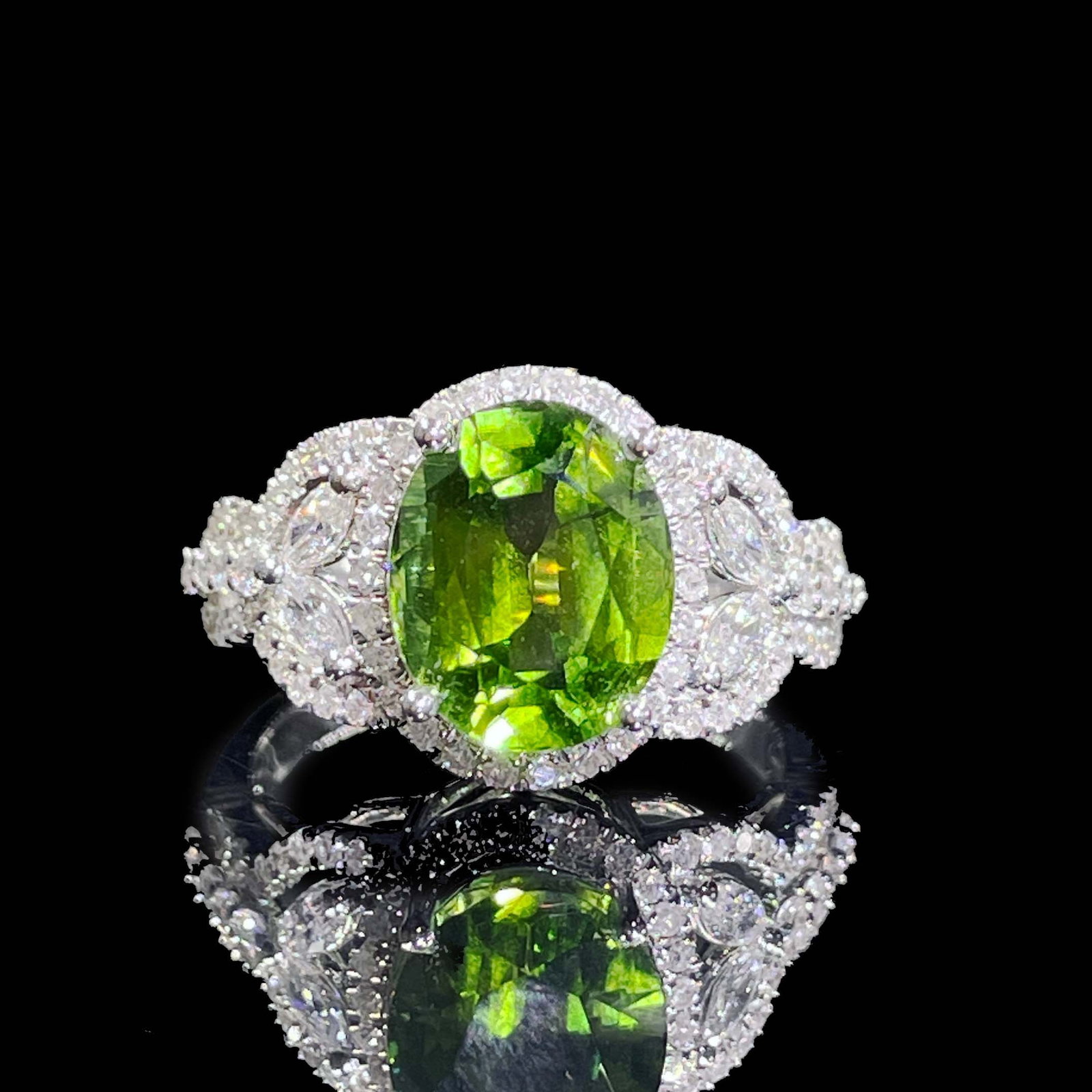 14k Gold 4.59 Ctw Natural Tourmaline & Diamond Ring: Ref:230975050 // gold content:14k gold // ring size:7. 25us // // main gemstone:tourmaline // shape:oval // carat weight:3. 71ct // color:green // treatment:natural // // adjacent gemstone 2 :
