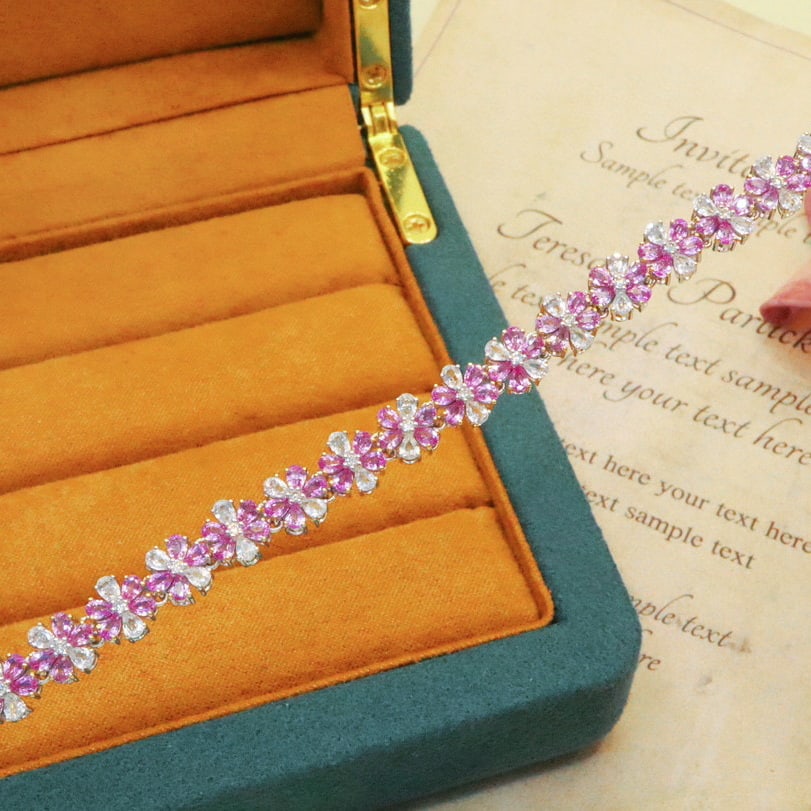14k Gold 6.87 Ctw Natural Padparadscha Sapphire & Diamond Bracelet: Ref:230976189 // gold content:14k gold // main gemstone:padparadscha sapphire // shape:pear // carat weight:6. 60ct // color:orangish pink // treatment:natural // // adjacent gemstone 2 : diamond //