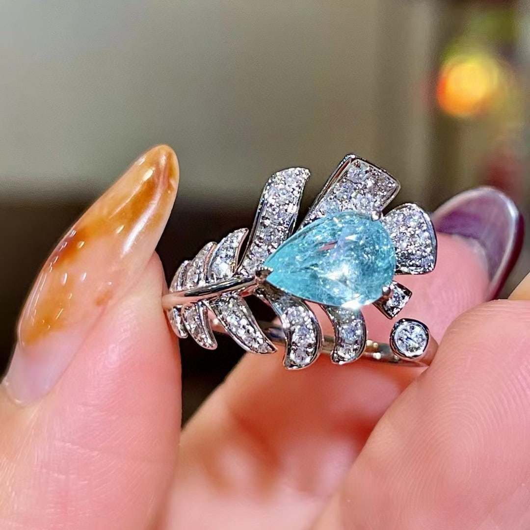 14k Gold 1.44 Ctw Natural Paraiba Tourmaline & Diamond Ring: Ref:230981098 / / gold content:14k gold / / ring size:7. 25us / / / / main gemstone:paraiba tourmaline / / shape:pear / / carat weight:1. 13ct / / color:blue / / treatment:natural / / / / adjacent