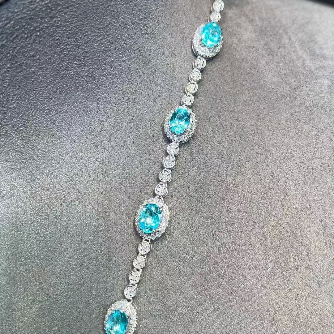 14k Gold 1.97 Ct Natural Paraiba Tourmaline & Diamond Bracelet: Ref:230982299 / / gold content:14k gold / / main gemstone:paraiba tourmaline / / shape:oval / / carat weight:1. 97ct / / color:blue / / treatment:natural / / / / adjacent gemstone 2 : diamond / /