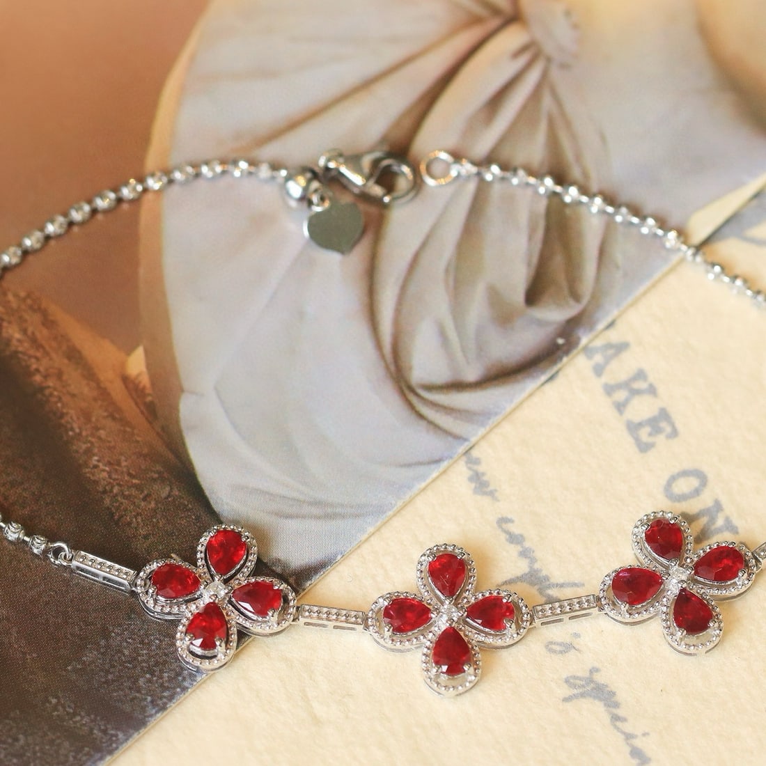 14k Gold 2.35 Ctw Natural Ruby & Diamond Bracelet: Ref:230982350 / / gold content:14k gold / / main gemstone:ruby / / shape:pear / / carat weight:2. 3ct / / color:pigeonblood red / / treatment:natural / / / / adjacent gemstone 2 : diamond / /