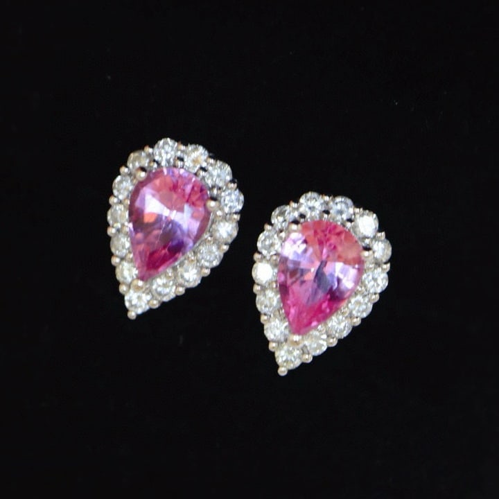 14k Gold 1.42 Ctw Natural Padparadscha Sapphire & Diamond Earrings: Ref:230979024 // gold content:14k gold // main gemstone:padparadscha sapphire // shape:pear // carat weight:1. 0ct // color:pink // treatment:natural // // adjacent gemstone 2 : diamond //
