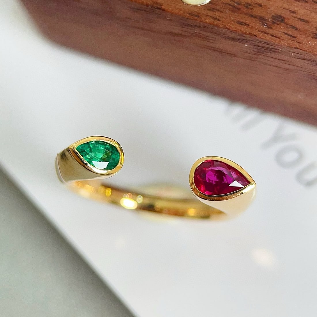 14k Gold 0.56 Ctw Natural Emerald & Ruby Ring: Ref:230979207 // gold content:14k gold // ring size:7. 25us // // main gemstone:emerald // shape:pear // carat weight:0. 2ct // color:green // treatment:natural // cut grade:g // // adjacent gemstone