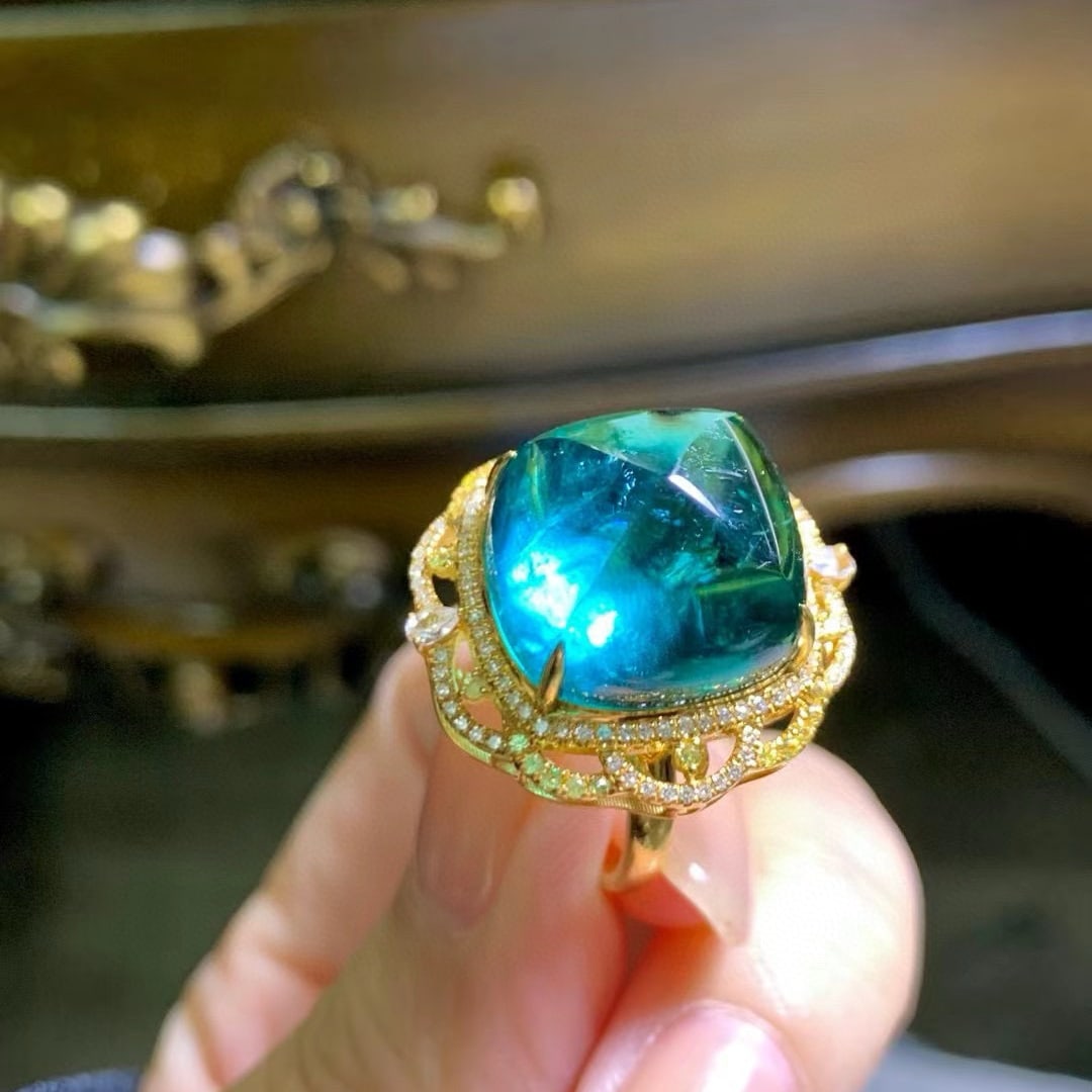 14k Gold 21.8 Ct Natural Tourmaline & Diamond Ring: Ref:230979254 // gold content:14k gold // ring size:7. 25us // // main gemstone:tourmaline // shape:suger-loaf // carat weight:21. 8ct // color:blue // treatment:natural // cut grade:g // // adjacent