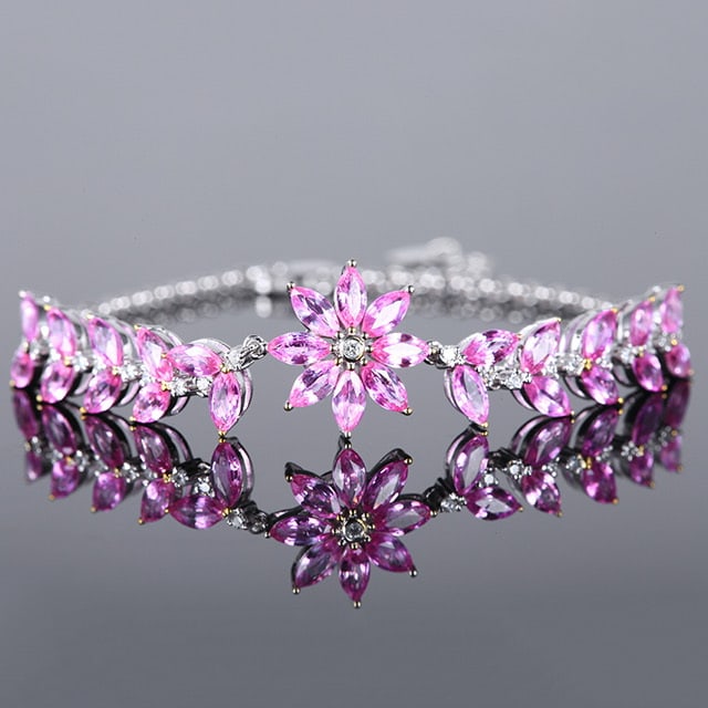 14k Gold 5.61 Ctw Natural Padparadscha Sapphire & Diamond Bracelet: Ref:230980093 // gold content:14k gold // main gemstone:padparadscha sapphire // shape:marquise // carat weight:5. 4ct // color:orangish pink // treatment:natural // // adjacent gemstone 2 : diamond /