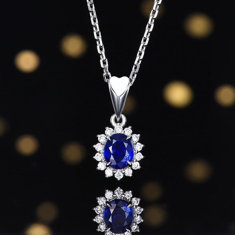 14k Gold 0.75 Ctw Vivid Blue Natural Sapphire & Diamond Pendant( Without Chain ): Ref:230980114 // gold content:14k gold // main gemstone:sapphire // shape:oval // carat weight:0. 61ct // color:vivid blue // treatment:natural // // adjacent gemstone 2 : diamond // number of