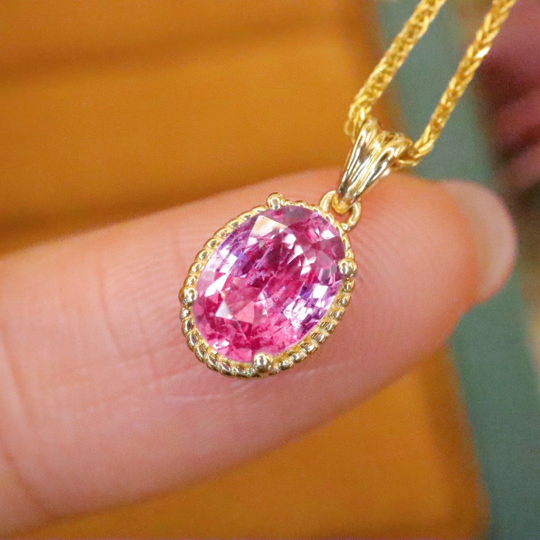 14k Gold 0.96 Ct Natural Padparadscha Sapphire Pendant( Without Chain ): Ref:230980117 // gold content:14k gold // main gemstone:padparadscha sapphire // shape:oval // carat weight:0. 96ct // color:orangish pink // treatment:natural // Condition: New High Estimate: 2800