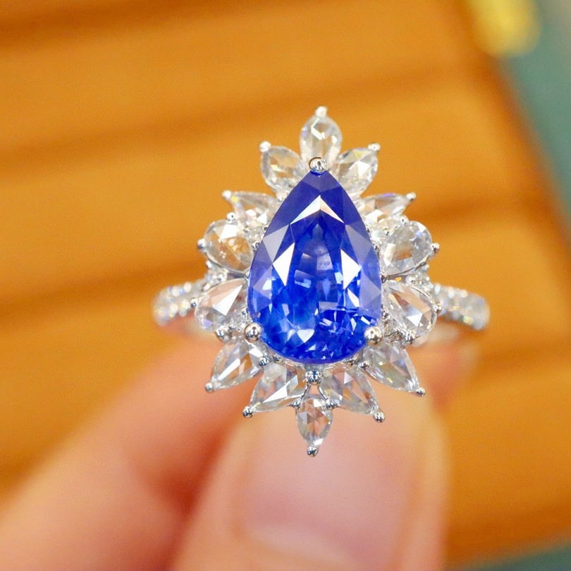 14k Gold 2.70 Ctw Natural Sapphire & Diamond Ring: Ref:230980139 // gold content:14k gold // ring size:7. 25us // // main gemstone:sapphire // shape:pear // carat weight:2. 05ct // color:cornflower blue // treatment:natural // // adjacent gemstone 2