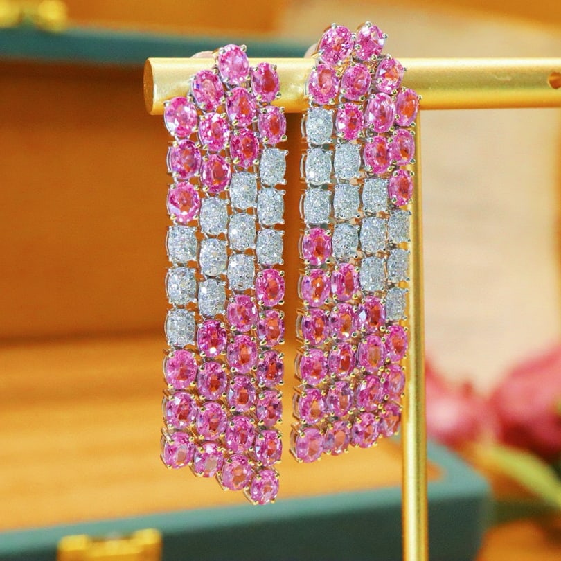 14k Gold 13.85 Ctw Natural Padparadscha Sapphire & Diamond Earrings: Ref:230980142 // gold content:14k gold // main gemstone:padparadscha sapphire // shape:oval // carat weight:13. 13ct // color:orangish pink // treatment:natural // // adjacent gemstone 2 : diamond // 
