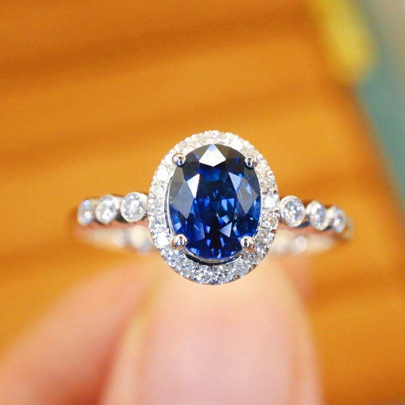 14k Gold 1.04 Ctw Natural Sapphire & Diamond Ring: Ref:230980191 // gold content:14k gold // ring size:7. 25us // // main gemstone:sapphire // shape:oval // carat weight:0. 86ct // color:royal blue // treatment:natural // // adjacent gemstone 2 :