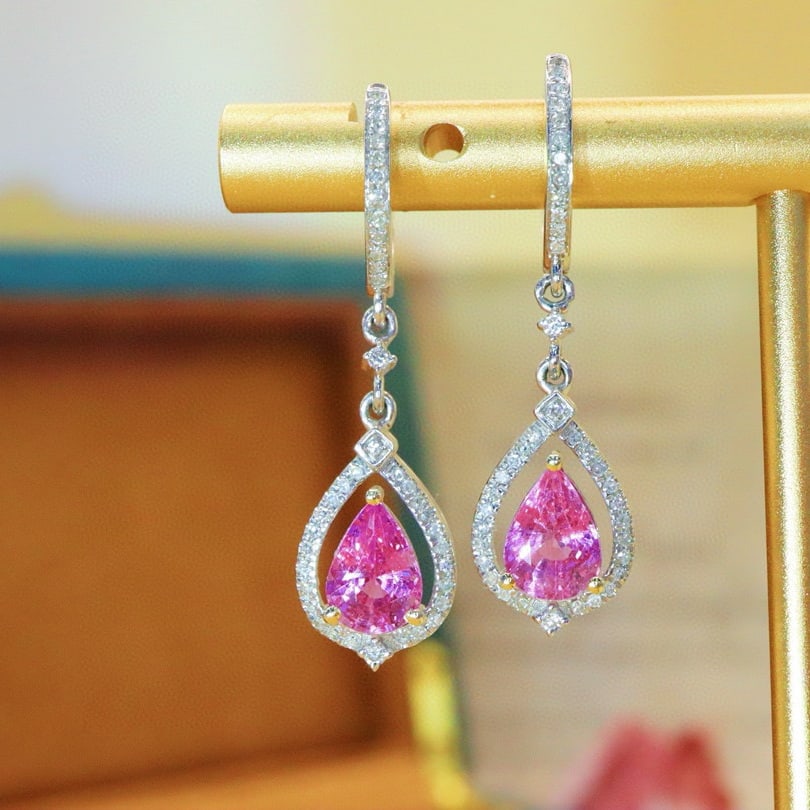 14k Gold 2.22 Ctw Natural Padparadscha Sapphire & Diamond Earrings: Ref:230980206 // gold content:14k gold // main gemstone:padparadscha sapphire // shape:pear // carat weight:1. 96ct // color:orangish pink // treatment:natural // // adjacent gemstone 2 : diamond //