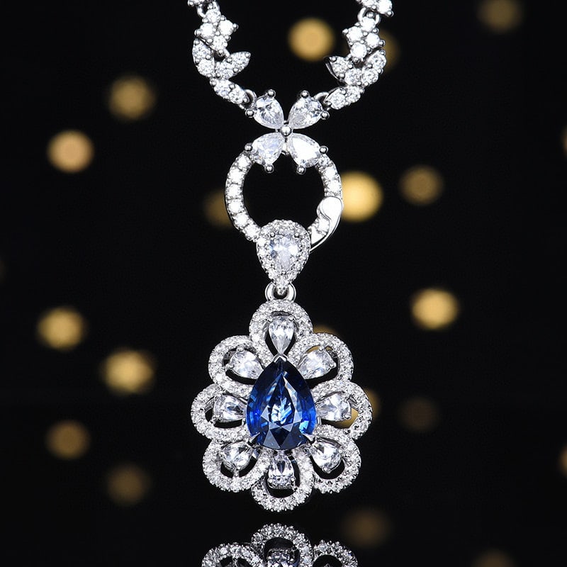 14k Gold 1.26 Ctw Natural Sapphire & Diamond Pendant( Without Chain ): Ref:230980218 // gold content:14k gold // main gemstone:sapphire // shape:pear // carat weight:1. 04ct // color:blue // treatment:natural // // adjacent gemstone 2 : diamond // number of stones:88 //