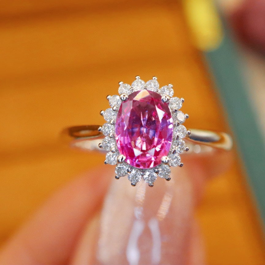 14k Gold 1.25 Ctw Natural Padparadscha Sapphire & Diamond Ring: Ref:230980288 // gold content:14k gold // ring size:7. 25us // // main gemstone:padparadscha sapphire // shape:oval // carat weight:1. 07ct // color:orangish pink // treatment:natural // // adjacent