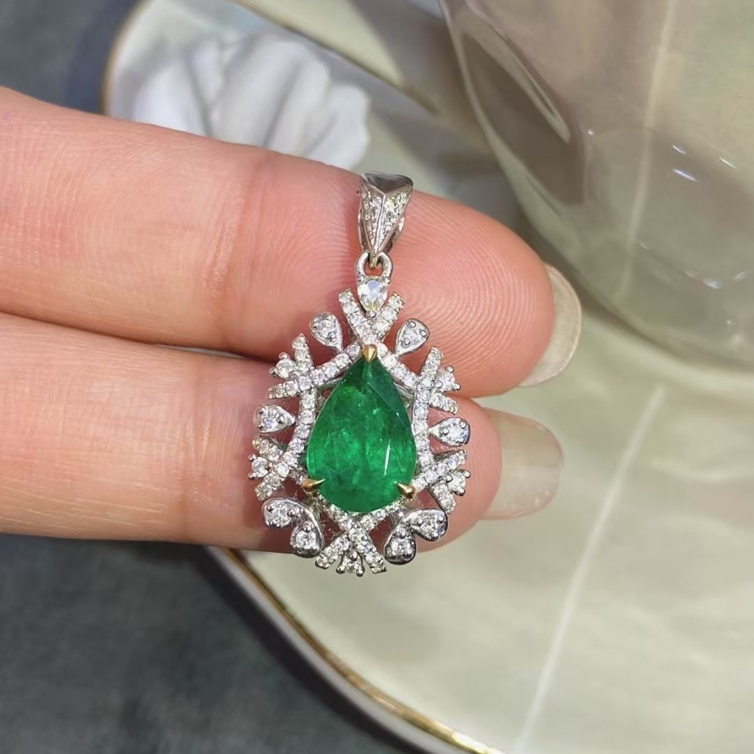 14k Gold 1.77 Ctw Vivid Green Natural Emerald & Sapphire Pendant( Without Chain ): Ref:230980353 // gold content:14k gold // main gemstone:emerald // shape:pear // carat weight:1. 7ct // color:vivid green // treatment:natural // // adjacent gemstone 2 : sapphire // shape:pear // car