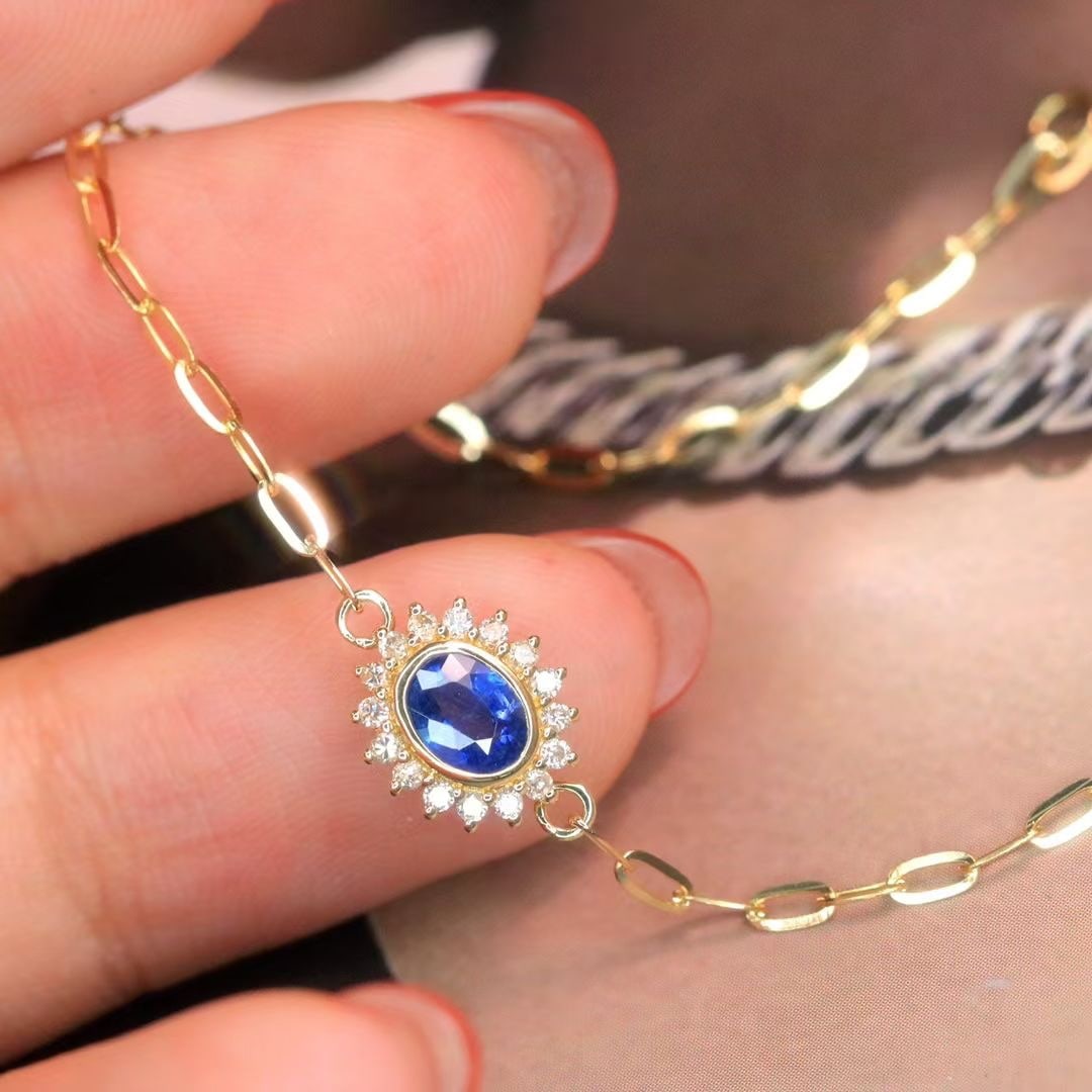 14k Gold 0.68 Ctw Natural Sapphire & Diamond Bracelet: Ref:230980362 // gold content:14k gold // main gemstone:sapphire // shape:oval // carat weight:0. 55ct // color:blue // treatment:natural // // adjacent gemstone 2 : diamond // shape:round // carat