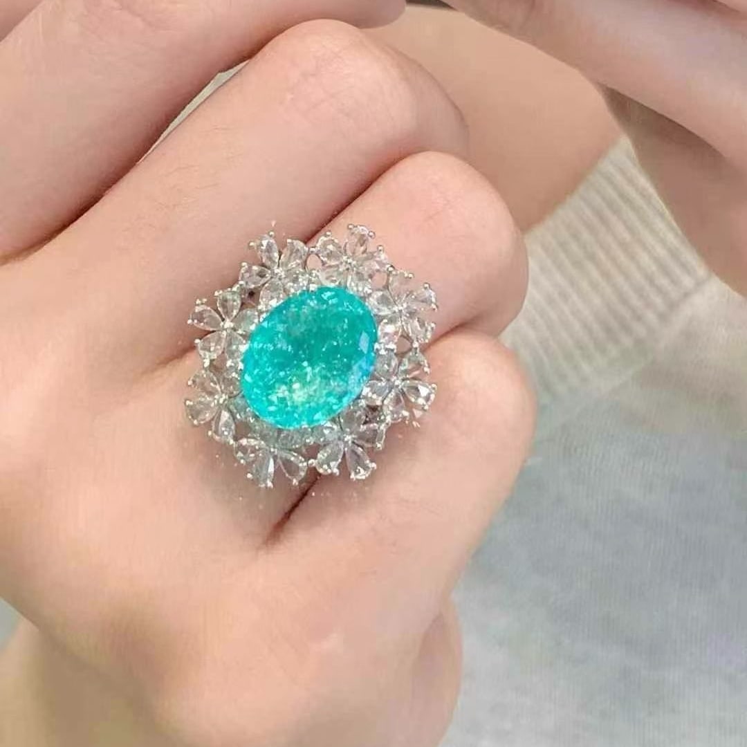 14k Gold 6.68 Ct Natural Paraiba Tourmaline & Diamond Ring: Ref:230980383 // gold content:14k gold // ring size:7. 25us // // main gemstone:paraiba tourmaline // shape:oval // carat weight:6. 68ct // color:neon blue // treatment:natural // // adjacent