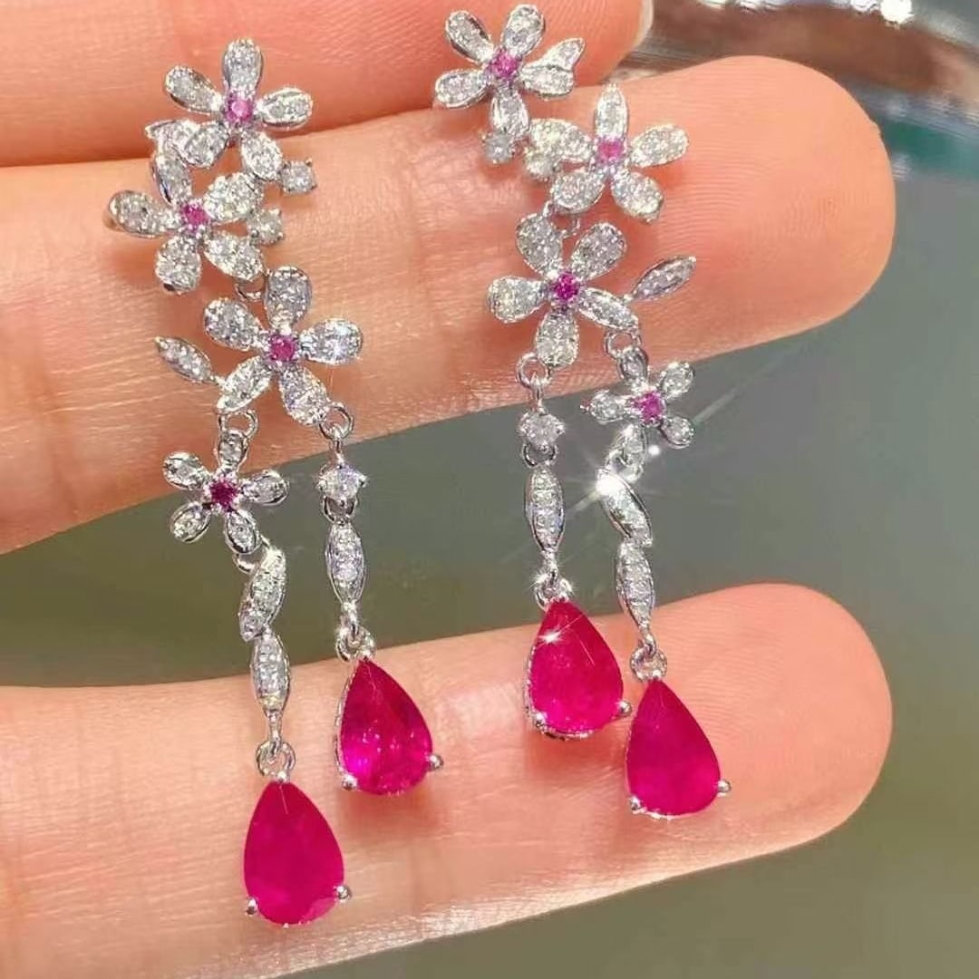 14k Gold 2.35 Ct Natural Ruby & Diamond Earrings: Ref:230980415 // gold content:14k gold // main gemstone:ruby // shape:pear // carat weight:2. 35ct // color:red // treatment:natural // // adjacent gemstone 2 : diamond // shape:round // clarity