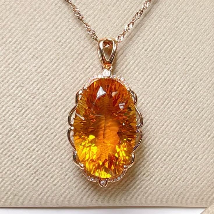 14k Gold 19.02 Ctw Natural Citrine & Diamond Pendant( Without Chain ): Ref:231147259 // gold content:14k gold // main gemstone:citrine // shape:oval // carat weight:18. 95ct // color:yellow // treatment:natural // // adjacent gemstone 2 : diamond // number of stones:22 /