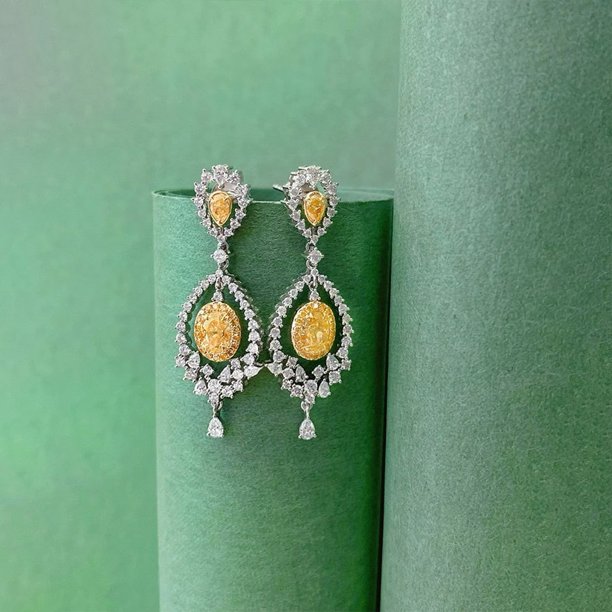 14k Gold 2.30 Ctw Natural Yellow Diamond & Diamond Earrings: Ref:231148001 // gold content:14k gold // main gemstone:yellow diamond // shape:oval // carat weight:1. 10ct // color:yellow // treatment:natural // // adjacent gemstone 2 : diamond // shape:multiple 