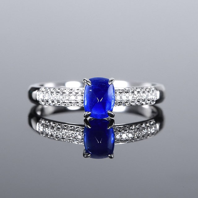 14k Gold 0.99 Ctw Vivid Blue Natural Sapphire & Diamond Ring: Ref:231148015 // gold content:14k gold // ring size:7. 25us // // main gemstone:sapphire // shape:sugar-loaf // carat weight:0. 85ct // color:vivid blue // treatment:natural // // adjacent gemstone 2