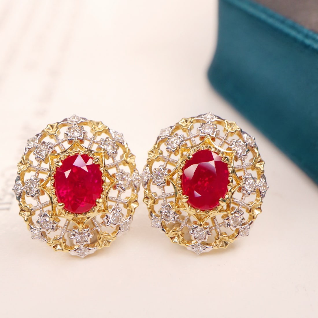 14k Gold 2.44 Ctw Natural Ruby & Diamond Earrings: Ref:231148038 // gold content:14k gold // main gemstone:ruby // shape:oval // carat weight:2. 20ct // color:red // treatment:natural // // adjacent gemstone 2 : diamond // shape:round // carat