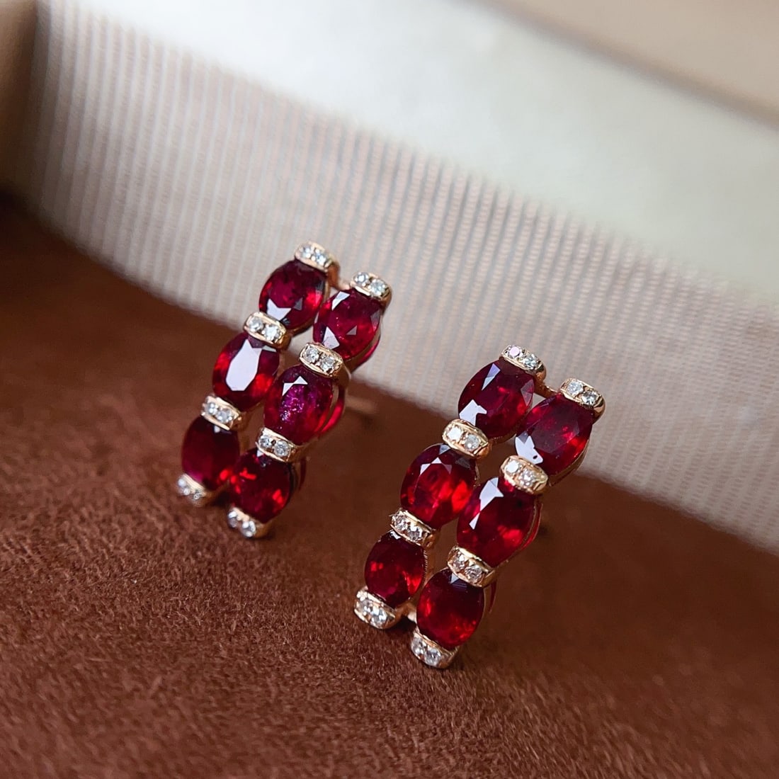 14k Gold 2.30 Ct Natural Ruby & Diamond Earrings: Ref:231148050 // gold content:14k gold // main gemstone:ruby // shape:oval // carat weight:2. 30ct // color:red // treatment:natural // // adjacent gemstone 2 : diamond // number of stones:26 // shape