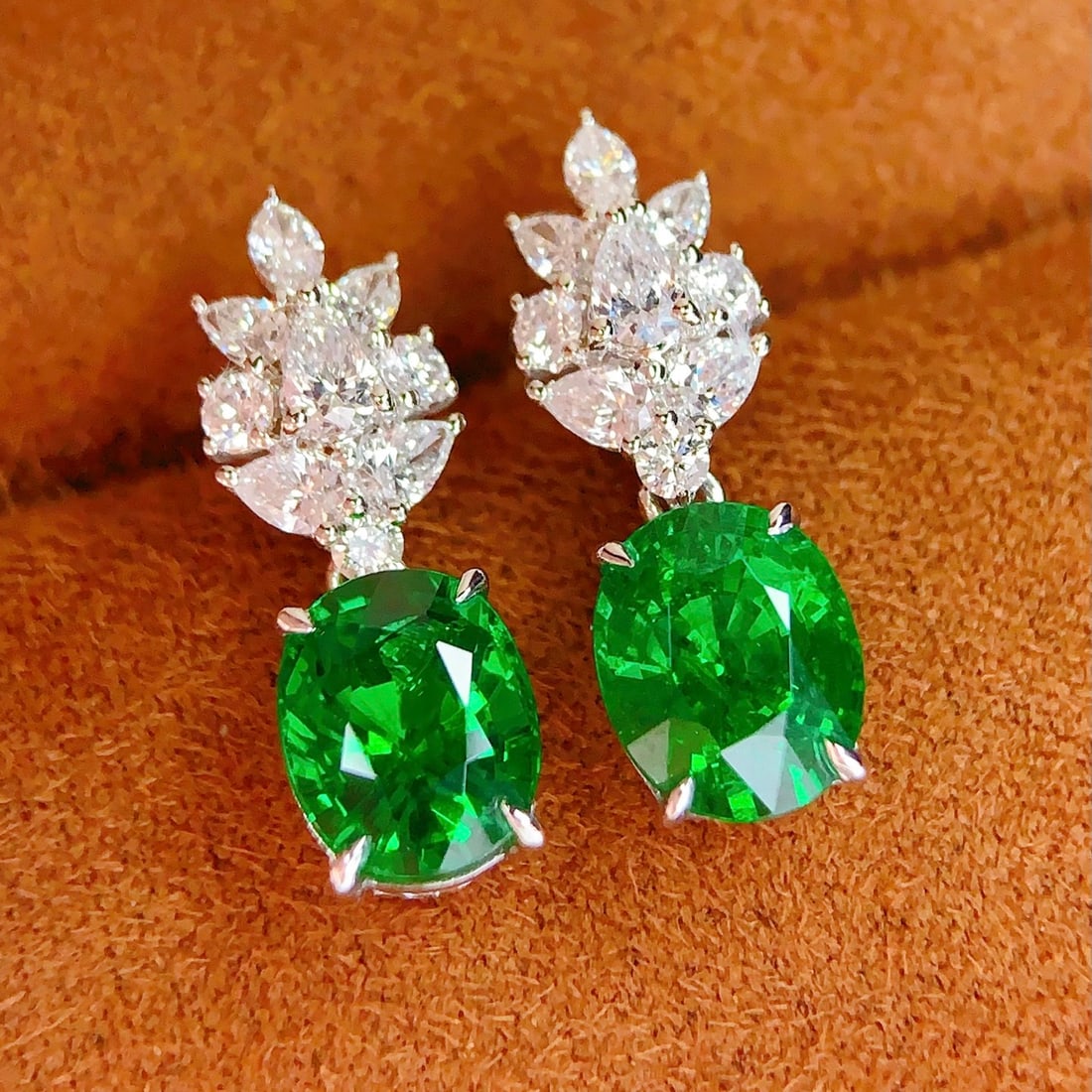 14k Gold 4.4 Ct Natural Tsavorite & Diamond Earrings: Ref:231148240 // gold content:14k gold // main gemstone:tsavorite // shape:oval // carat weight:4. 4ct // color:green // treatment:natural // // adjacent gemstone 2 : diamond // number of stones:18 //