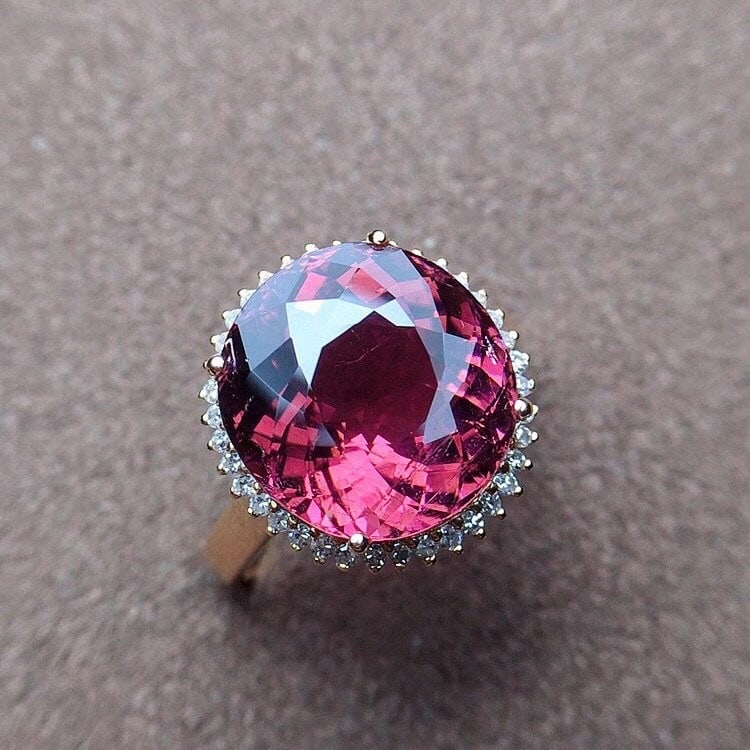 14k Gold 7.6 Ct Natural Tourmaline & Diamond Ring: Ref:231148344 // gold content:14k gold // ring size:7. 25us // // main gemstone:tourmaline // shape:oval // carat weight:7. 6ct // color:red // treatment:natural // // adjacent gemstone 2 : diamond //