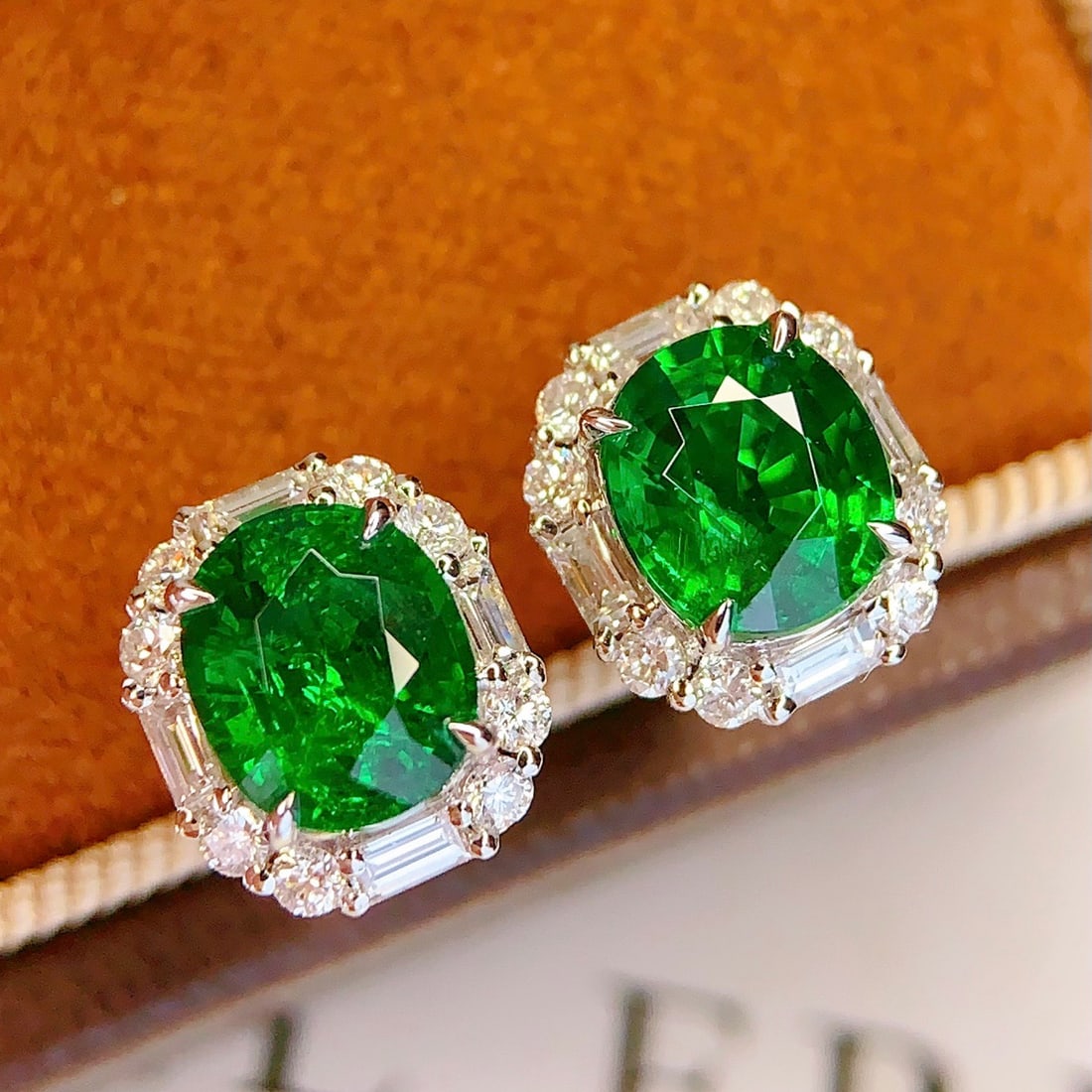 14k Gold 3.15 Ct Vivid Green Natural Tsavorite & Diamond Earrings: Ref:231148348 // gold content:14k gold // main gemstone:tsavorite // shape:oval // carat weight:3. 15ct // color:vivid green // treatment:natural // // adjacent gemstone 2 : diamond // number of stone