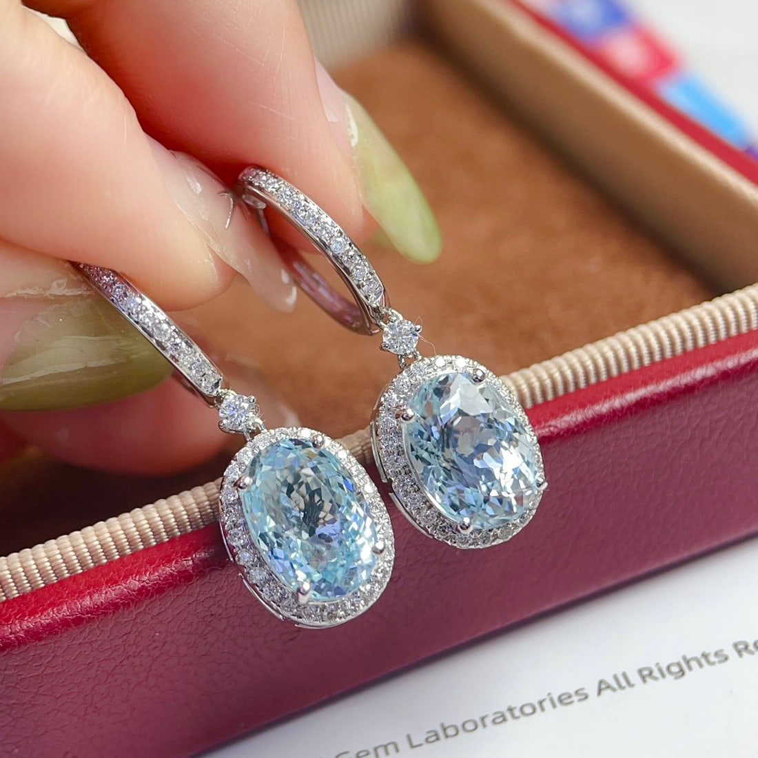 14k Gold 6.56 Ctw Natural Aquamarine & Diamond Earrings: Ref:231150225 // gold content:14k gold // main gemstone:aquamarine // shape:oval // carat weight:6. 1ct // color:blue // treatment:natural // // adjacent gemstone 2 : diamond // shape:round // carat w