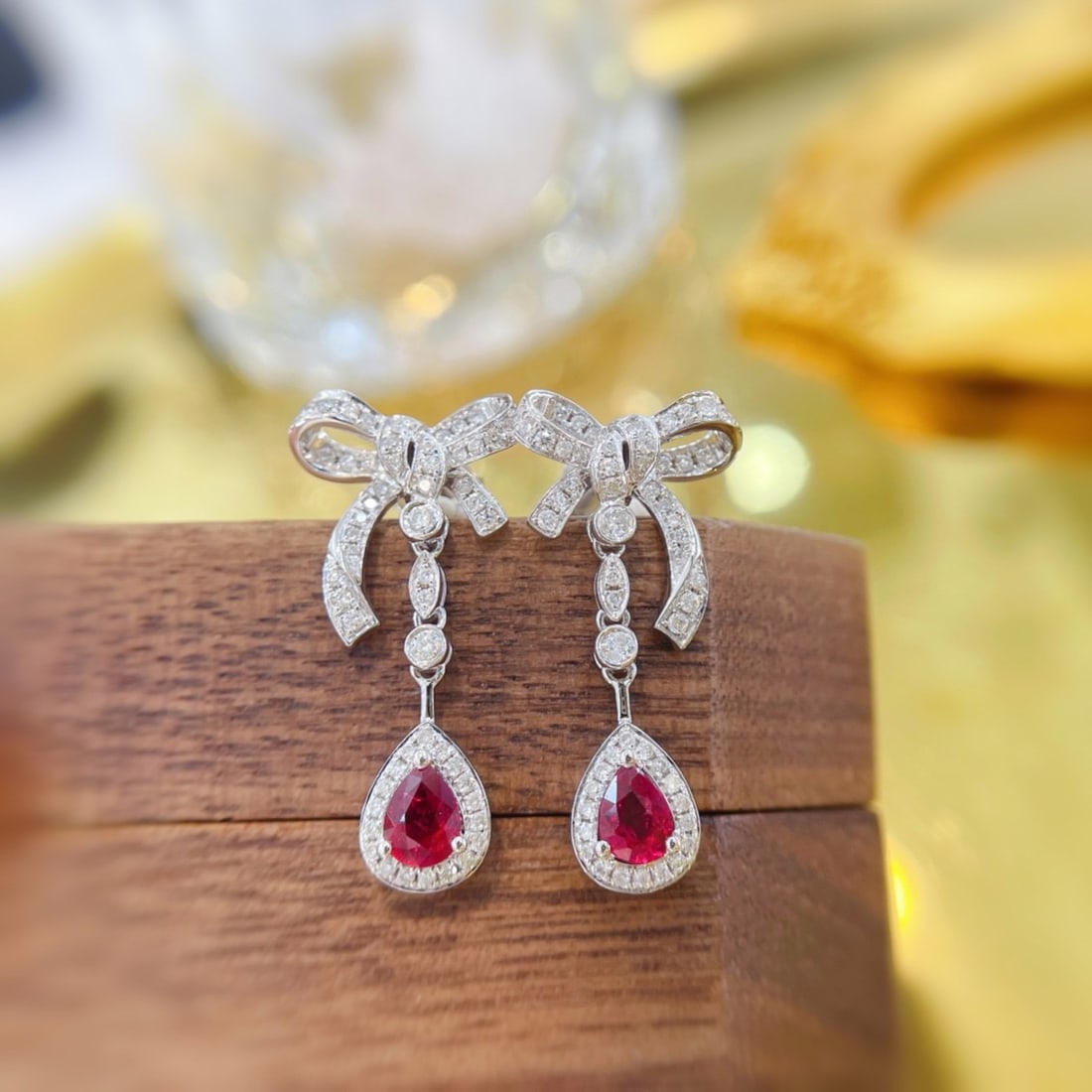 14k Gold 0.92 Ctw Natural Ruby & Diamond Earrings: Ref:231150328 // gold content:14k gold // main gemstone:ruby // shape:pear // carat weight:0. 52ct // color:red // treatment:natural // // adjacent gemstone 2 : diamond // shape:round // carat weight: