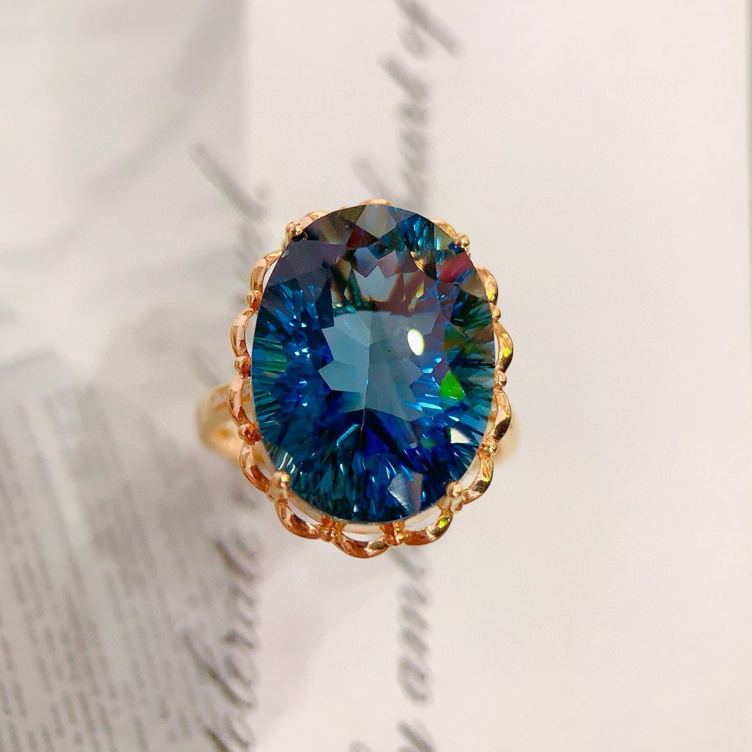 14k Gold 15.98 Ctw Natural Topaz & Diamond Ring: Ref:231151097 // gold content:14k gold // ring size:7. 25us // // main gemstone:topaz // shape:oval // carat weight:15. 95ct // color:blue // treatment:natural // // adjacent gemstone 2 : diamond //