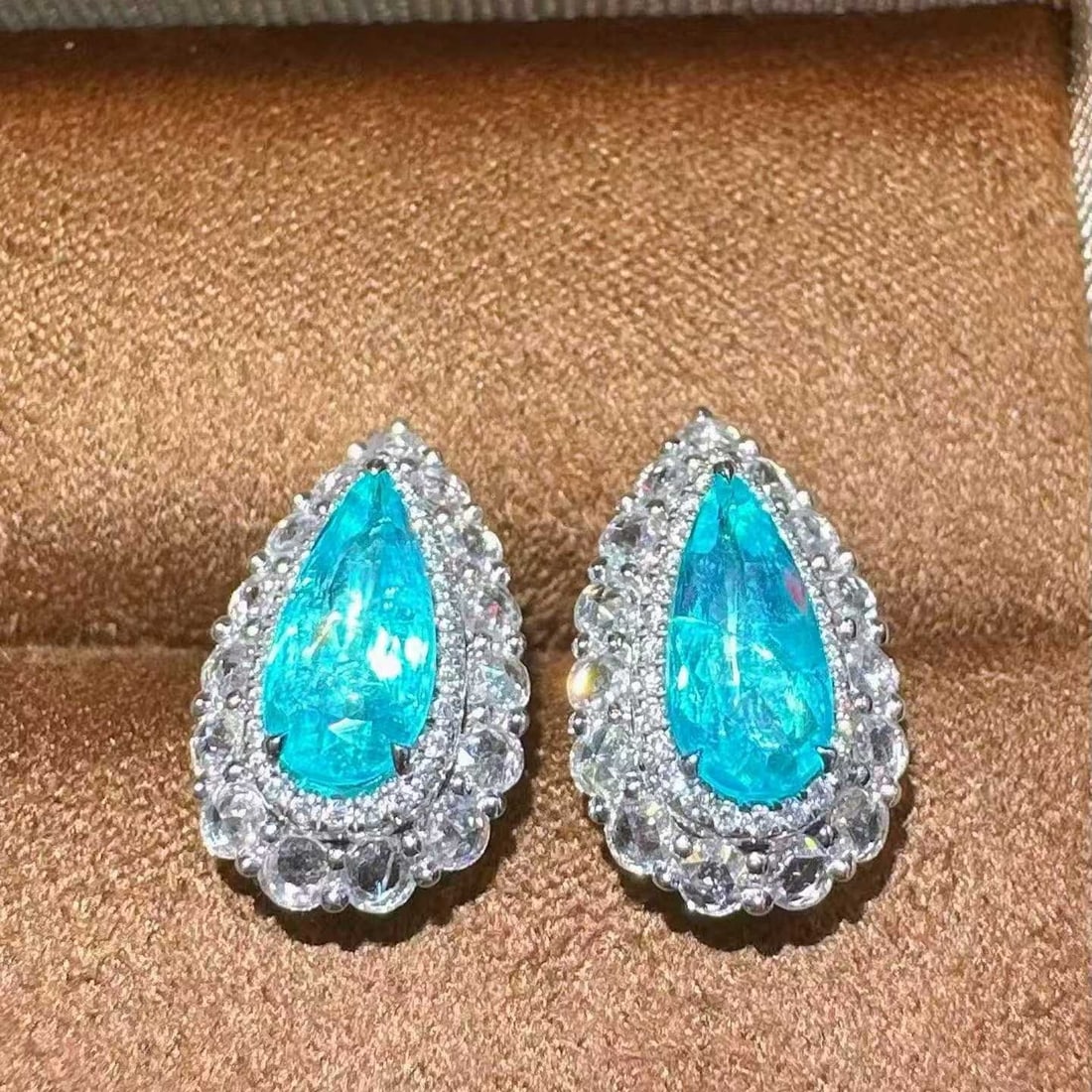 14k Gold 2.77 Ctw Natural Paraiba Tourmaline & Diamond Earrings: Ref:231151181 // gold content:14k gold // main gemstone:paraiba tourmaline // shape:pear // carat weight:1. 88ct // color:blue // treatment:natural // // adjacent gemstone 2 : diamond // shape:round /