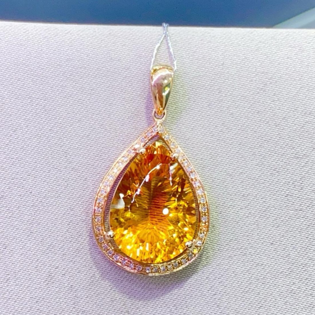 14k Gold 8.23 Ctw Natural Citrine & Diamond Pendant( Without Chain ): Ref:231151192 // gold content:14k gold // main gemstone:citrine // shape:pear // carat weight:8. 1ct // color:yellow // treatment:natural // // adjacent gemstone 2 : diamond // number of stones:45 //