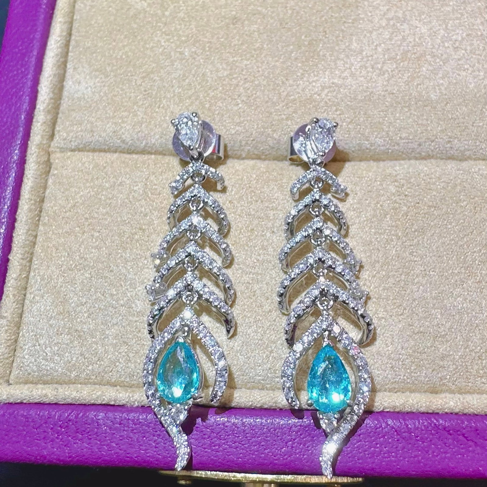 14k Gold 1.60 Ctw Natural Paraiba Tourmaline & Diamond Earrings: Ref:231152420 // gold content:14k gold // main gemstone:paraiba tourmaline // shape:pear // carat weight:0. 66ct // color:blue // treatment:natural // // adjacent gemstone 2 : diamond // shape:multipl