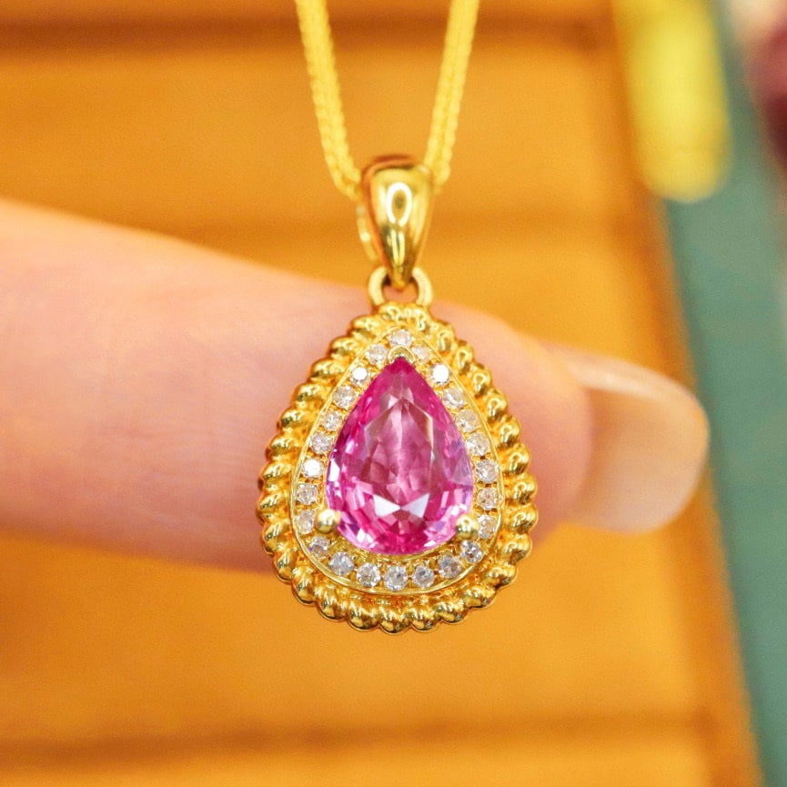 14k Gold 0.99 Ctw Natural Sapphire & Diamond Pendant( Without Chain ): Ref:230989083 // gold content:14k gold // main gemstone:sapphire // shape:pear // carat weight:0. 92ct // color:padparadscha // treatment:natural // cut grade:g // // adjacent gemstone 2 : diamond //