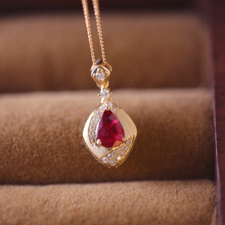 14k Gold 0.63 Ctw Natural Ruby & Diamond Earrings: Ref:230989142 // gold content:14k gold // main gemstone:ruby // shape:pear // carat weight:0. 55ct // color:red // treatment:natural // cut grade:g // // adjacent gemstone 2 : diamond // shape:round