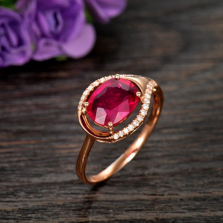 14k Gold 1.76 Ctw Natural Tourmaline & Diamond Ring: Ref:230989149 // gold content:14k gold // ring size:7. 25us // // main gemstone:tourmaline // shape:oval // carat weight:1. 65ct // color:red // treatment:natural // cut grade:g // // adjacent gemston
