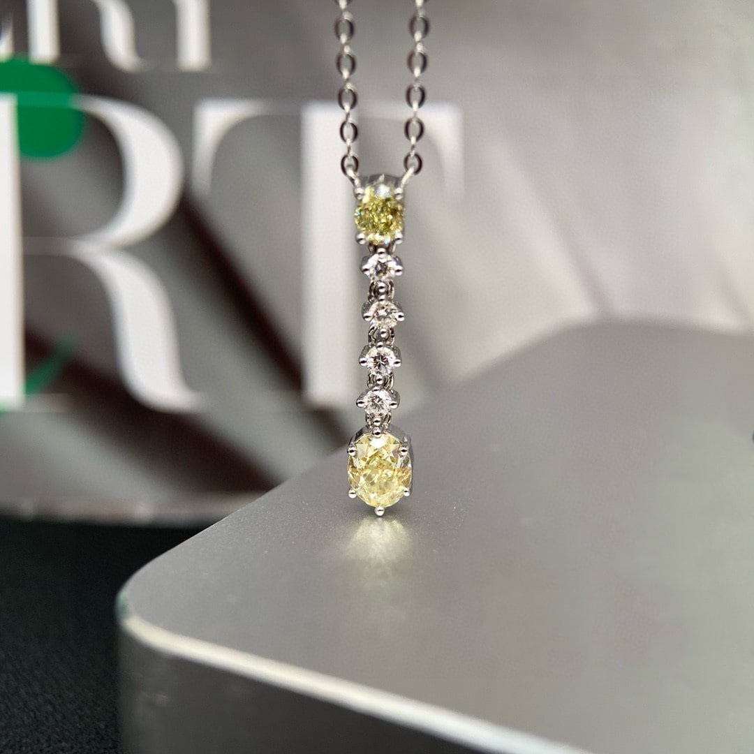 14k Gold 0.60 Ctw Natural Yellow Diamond & Diamond Pendant( Without Chain ): Ref:230989247 // gold content:14k gold // main gemstone:yellow diamond // shape:pear // carat weight:0. 48ct // color:yellow // treatment:natural // cut grade:g // // adjacent gemstone 2 : diamond // 