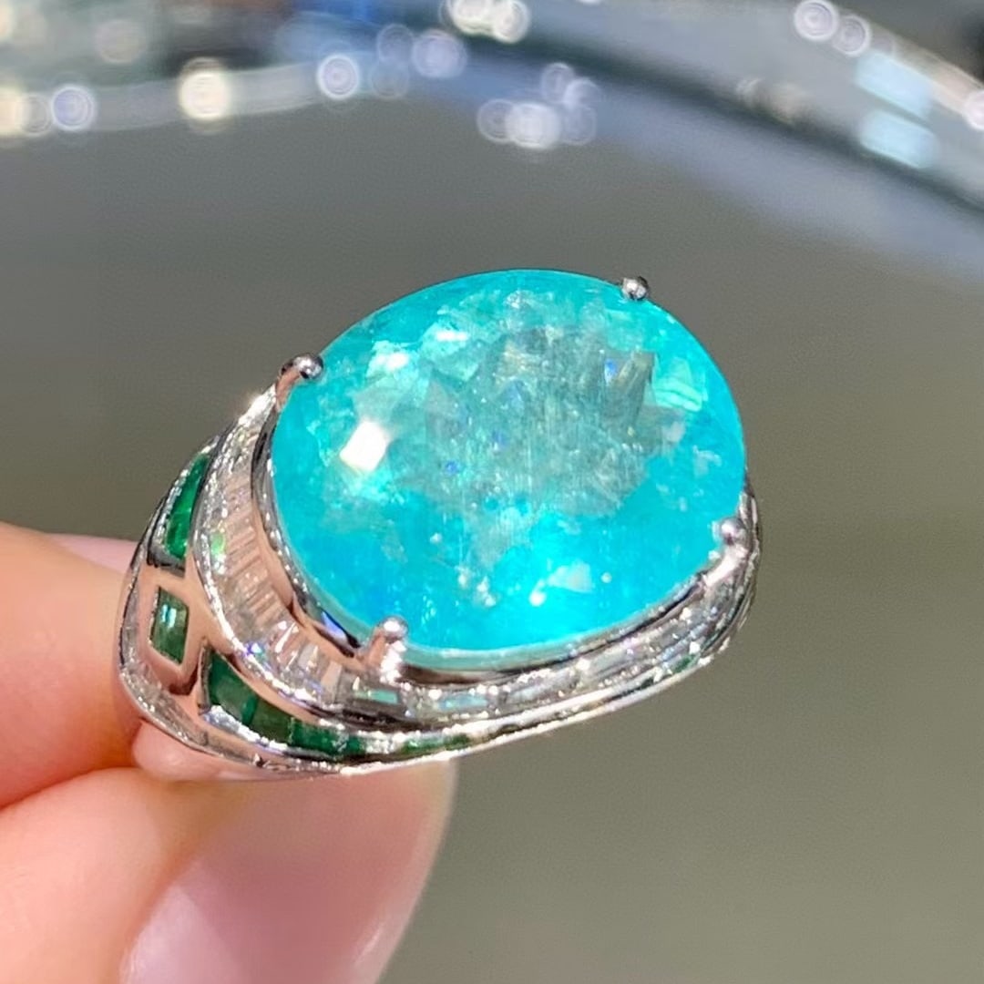 14k Gold 6.88 Ct Natural Paraiba Tourmaline & Diamond & Emerald Ring: Ref:230990125 // gold content:14k gold // ring size:7. 25us // // main gemstone:paraiba tourmaline // shape:oval // carat weight:6. 88ct // color:neon blue // treatment:natural // // adjacent