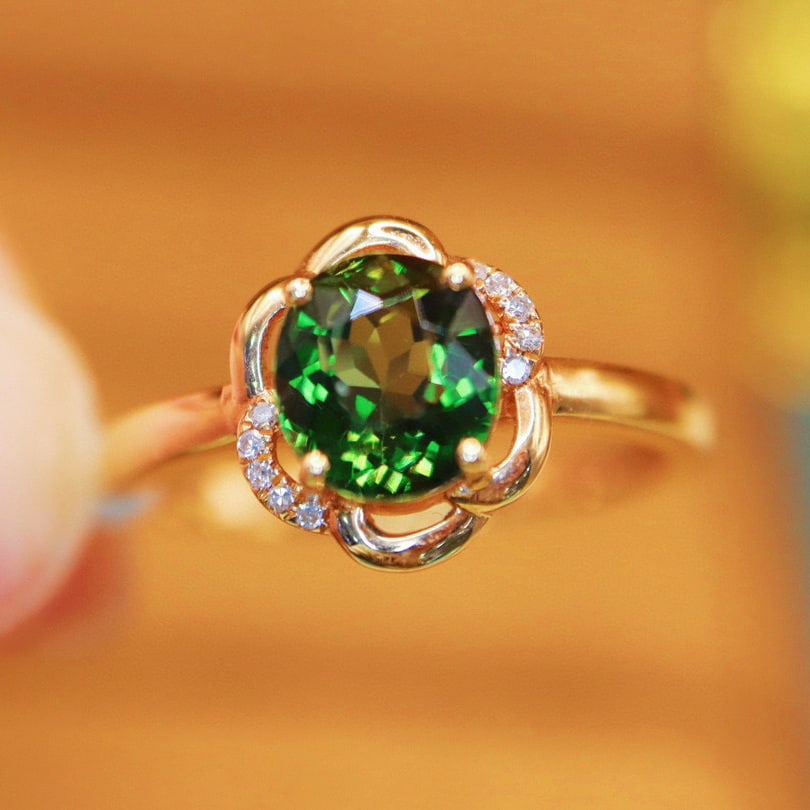 14k Gold 1.64 Ctw Natural Tourmaline & Diamond Ring: Ref:230990128 // gold content:14k gold // ring size:7. 25us // // main gemstone:tourmaline // shape:oval // carat weight:1. 61ct // color:green // treatment:natural // // adjacent gemstone 2 :