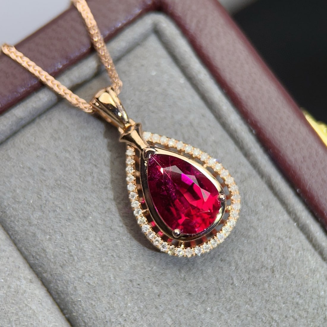 14k Gold 1.65 Ct Natural Tourmaline & Diamond Pendant( Without Chain ): Ref:230990130 // gold content:14k gold // main gemstone:tourmaline // shape:pear // carat weight:1. 65ct // color:red // treatment:natural // // adjacent gemstone 2 : diamond // number of stones:38 //