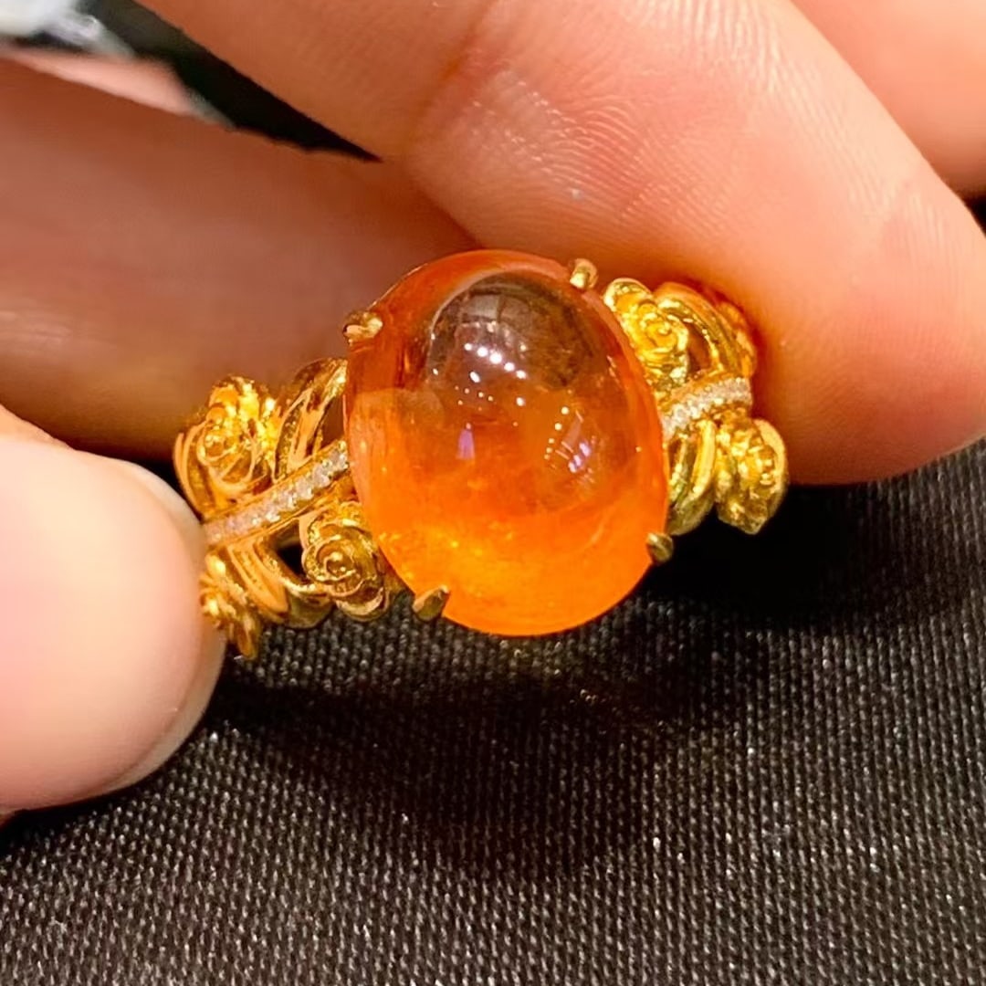 14k Gold 7.8 Ct Natural Spessartine & Diamond Ring: Ref:230990162 // gold content:14k gold // ring size:7. 25us // // main gemstone:spessartine // shape:oval // carat weight:7. 8ct // color:orange // treatment:natural // // adjacent gemstone 2 :