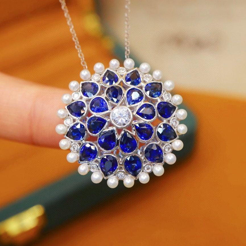 14k Gold 5.80 Ctw Natural Sapphire & Diamond Brooch/pendant( Without Chain ): Ref:230990171 // gold content:14k gold // main gemstone:sapphire // shape:pear // carat weight:5. 68ct // color:royal blue // treatment:natural // // adjacent gemstone 2 : diamond // number of