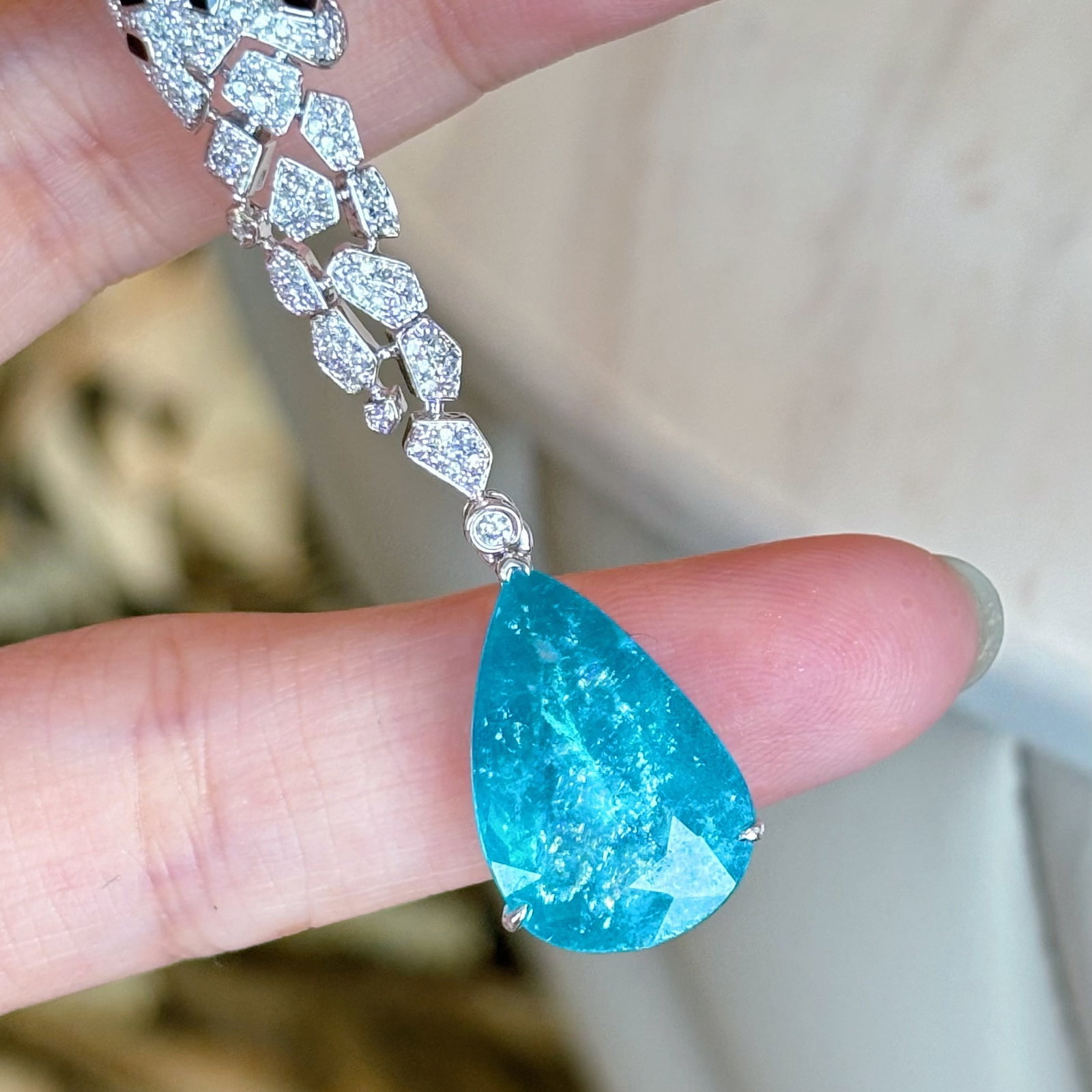 14k Gold 6.4 Ct Natural Paraiba Tourmaline & Diamond Pendant( Without Chain ): Ref:230990279 // gold content:14k gold // main gemstone:paraiba tourmaline // shape:pear // carat weight:6. 4ct // color:blue // treatment:natural // // adjacent gemstone 2 : diamond // shape:round //