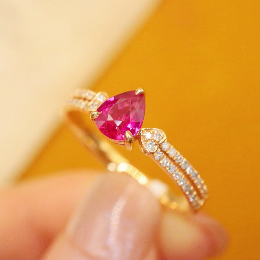 14k Gold 0.74 Ctw Natural Ruby & Diamond Ring: Ref:230990283 // gold content:14k gold // ring size:7. 25us // // main gemstone:ruby // shape:pear // carat weight:0. 60ct // color:red // treatment:natural // // adjacent gemstone 2 : diamond //