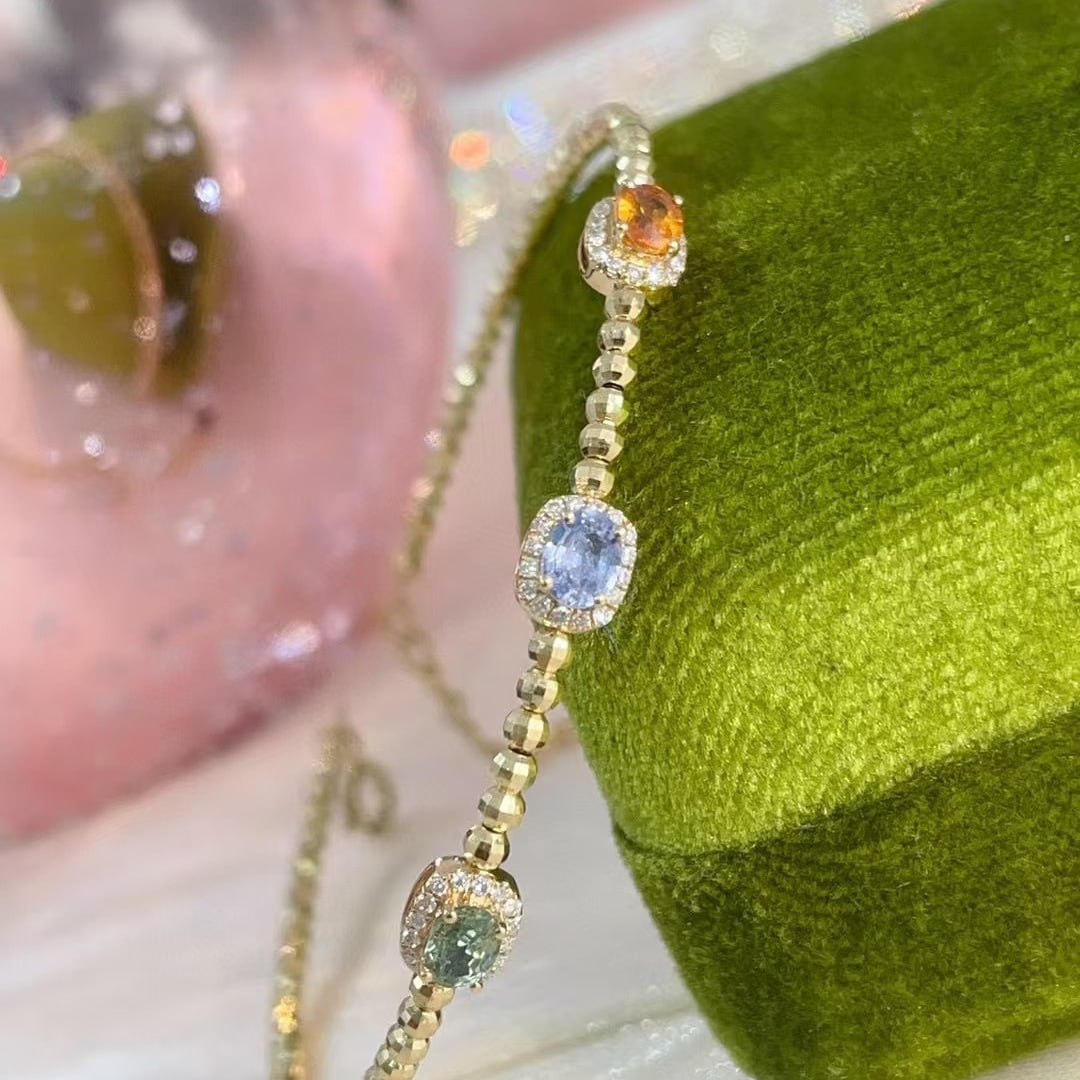 14k Gold 0.90 Ctw Natural Sapphire & Diamond Bangle: Ref:230990293 // gold content:14k gold // main gemstone:sapphire // shape:oval // carat weight:0. 75ct // color:color // treatment:natural // // adjacent gemstone 2 : diamond // shape:round // carat
