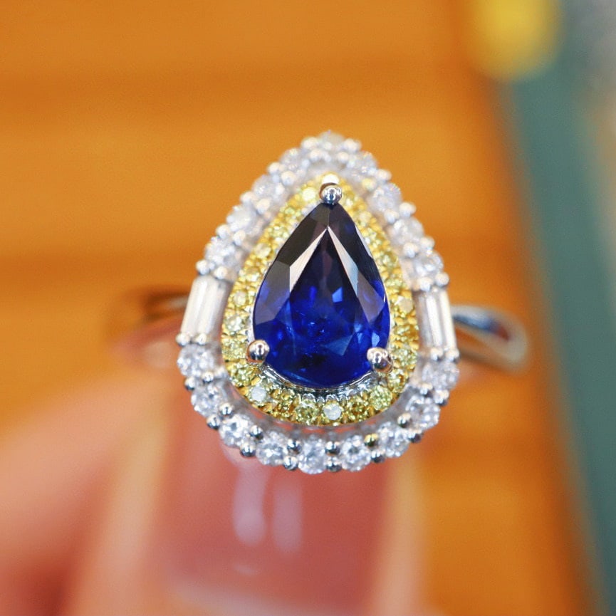 14k Gold 1.19 Ctw Natural Sapphire & Diamond Ring: Ref:230990386 // gold content:14k gold // ring size:7. 25us // // main gemstone:sapphire // shape:pear // carat weight:0. 90ct // color:royal blue // treatment:natural // // adjacent gemstone 2 :