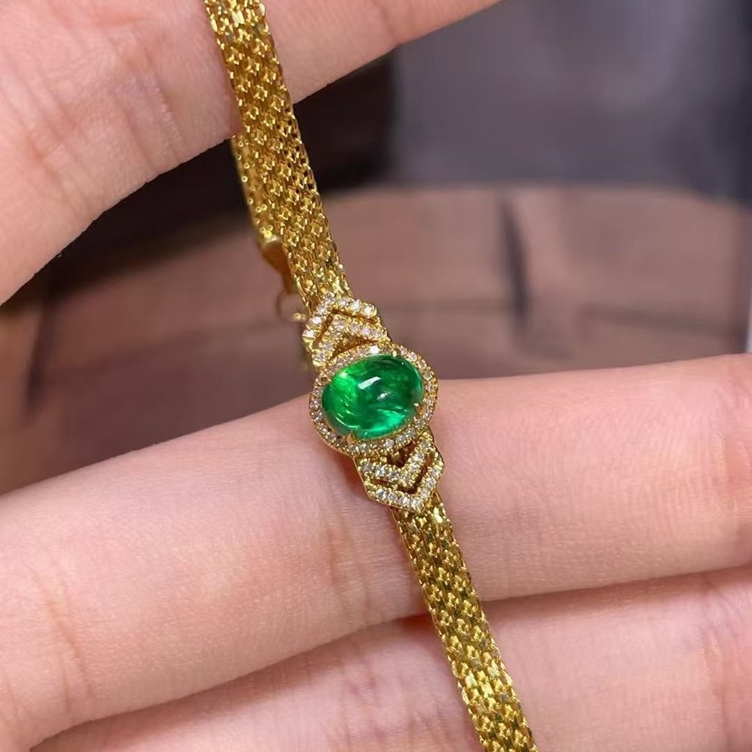 14k Gold 0.9 Ct Vivid Green Natural Emerald & Diamond Bracelet: Ref:230990410 // gold content:14k gold // main gemstone:emerald // shape:oval // carat weight:0. 9ct // color:vivid green // treatment:natural // // adjacent gemstone 2 : diamond // shape:round // cla